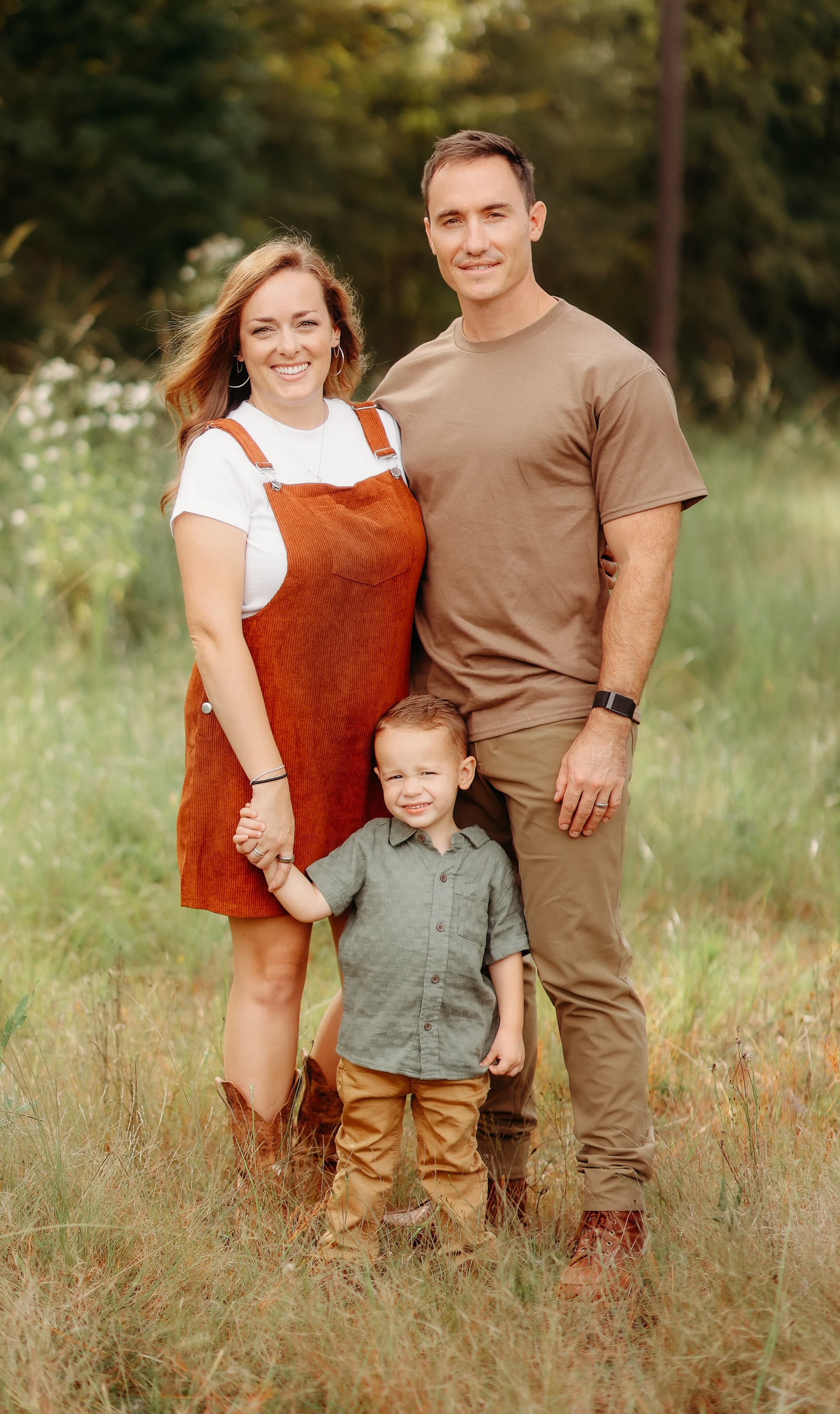 Alex Fisher with his wife and son